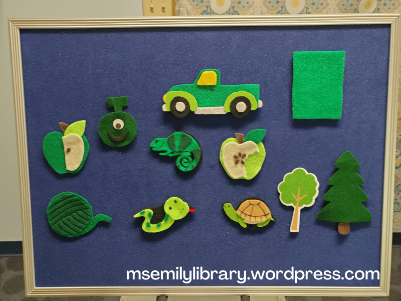 Lots of green flannel pieces, culled from many sets. Includes dark and light green apples, alien, yarn, snake, turtle, chameleon, truck, rectangle, and two trees.