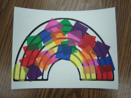 sheet showing a black and white rainbow arc with colorful tissue paper squares glued to it.