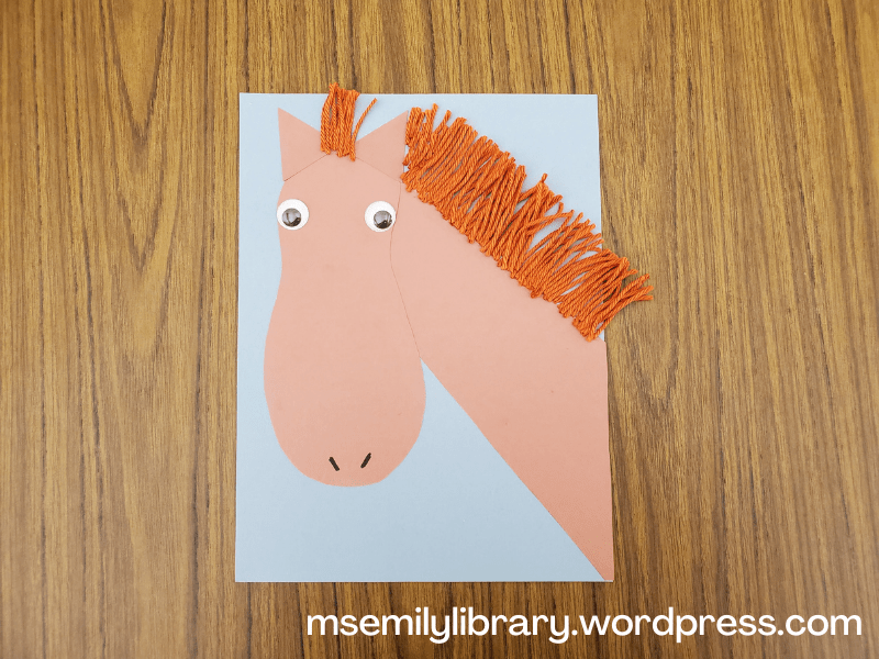 picture of craft, with horse neck, head, and ears as separate construction paper pieces, with googly eyes and yarn mane.