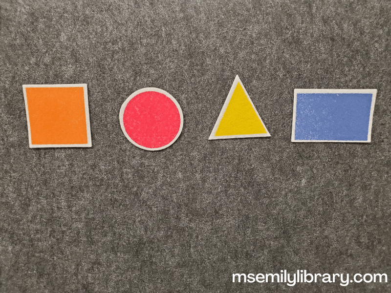 basic felt shapes - an orange square, red circle, yellow triangle, and blue rectangle.