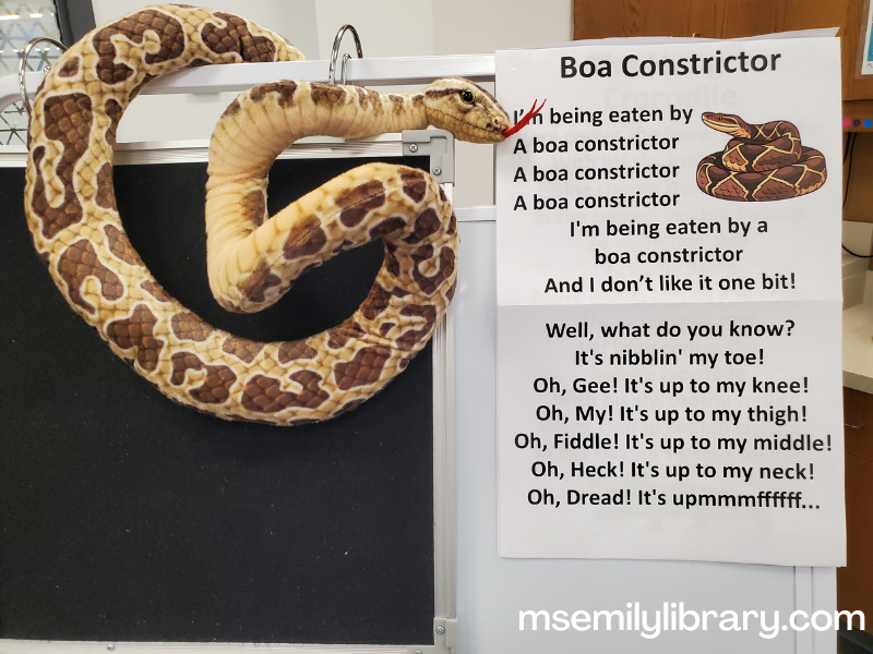 boa constrictor rhyme sheet with stuffed snake on storytime easel