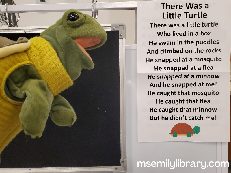 There was a little turtle rhyme sheet with turtleneck turtle puppet in front of storytime easel