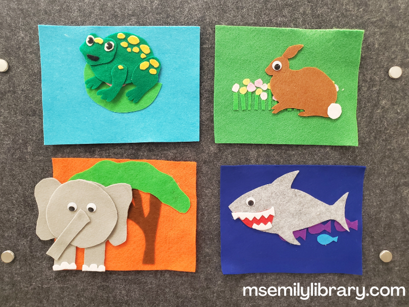 animal habitat flannel revealing animals: frog on the lily pad, a rabbit in the meadow, an elephant on the savannah, and shark in the ocean