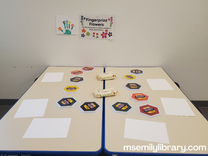 art station with paper, stamp pads, and baby wipes.