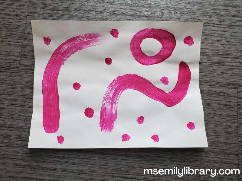 scented paint sample, showing abstract pink swirls and dots.