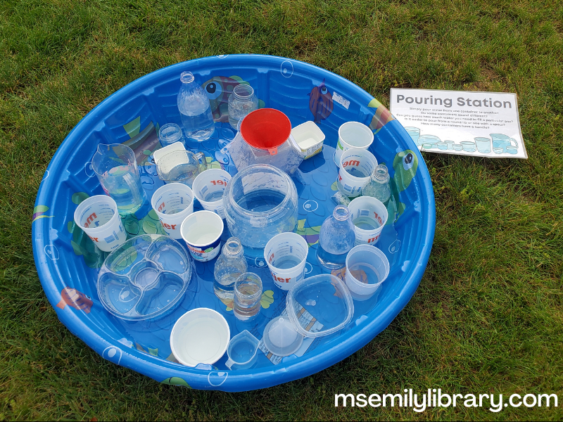 baby pool filled with various recycled plastic containers