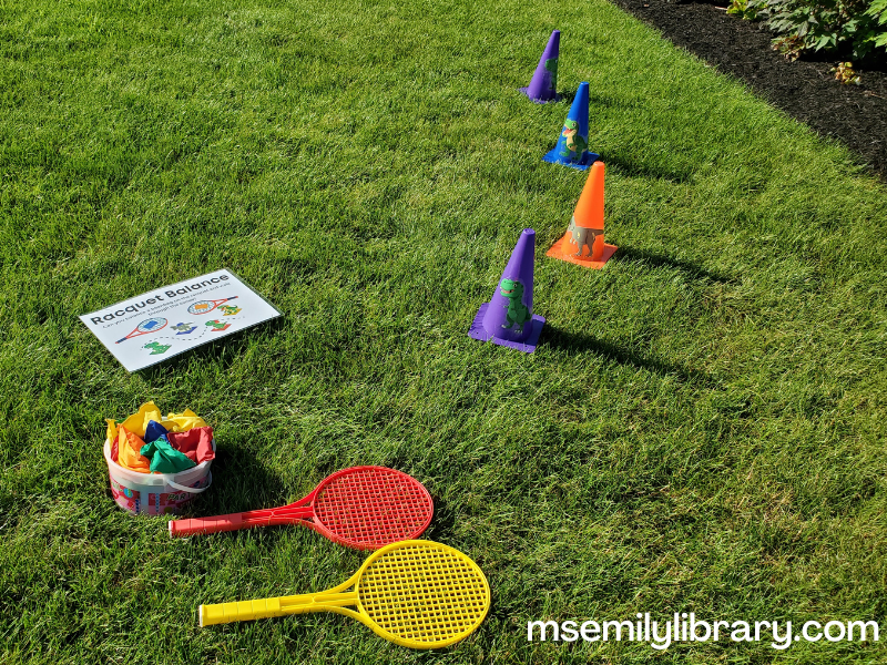 athletic cones, plastic racquets, and a bucket of beanbags