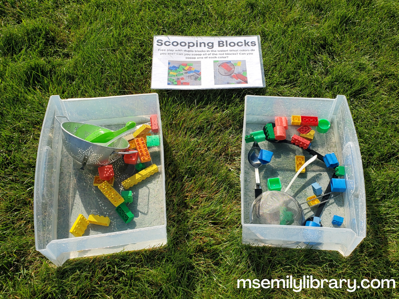 water bins with duplos, shape sorter shapes, sieves, colanders, ladles and spoons