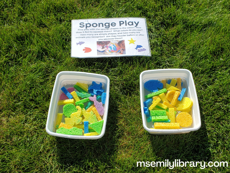 water bin with colored sponges in various shapes (rectangles, triangles, circles, seahorses, sharks, dolphins, etc)