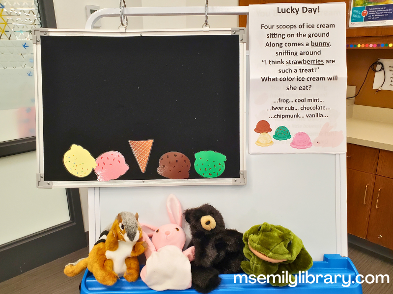 lucky day flannel, showing four ice cream scoops fallen off a waffle cone and a chipmunk, rabbit, bear, and frog puppet on the easel.